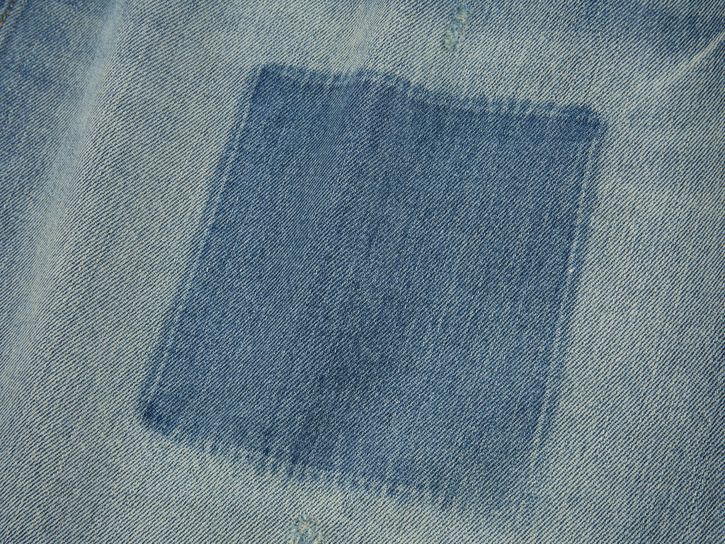 Distressed denim cargo skirt
