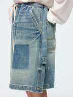 Distressed denim cargo skirt