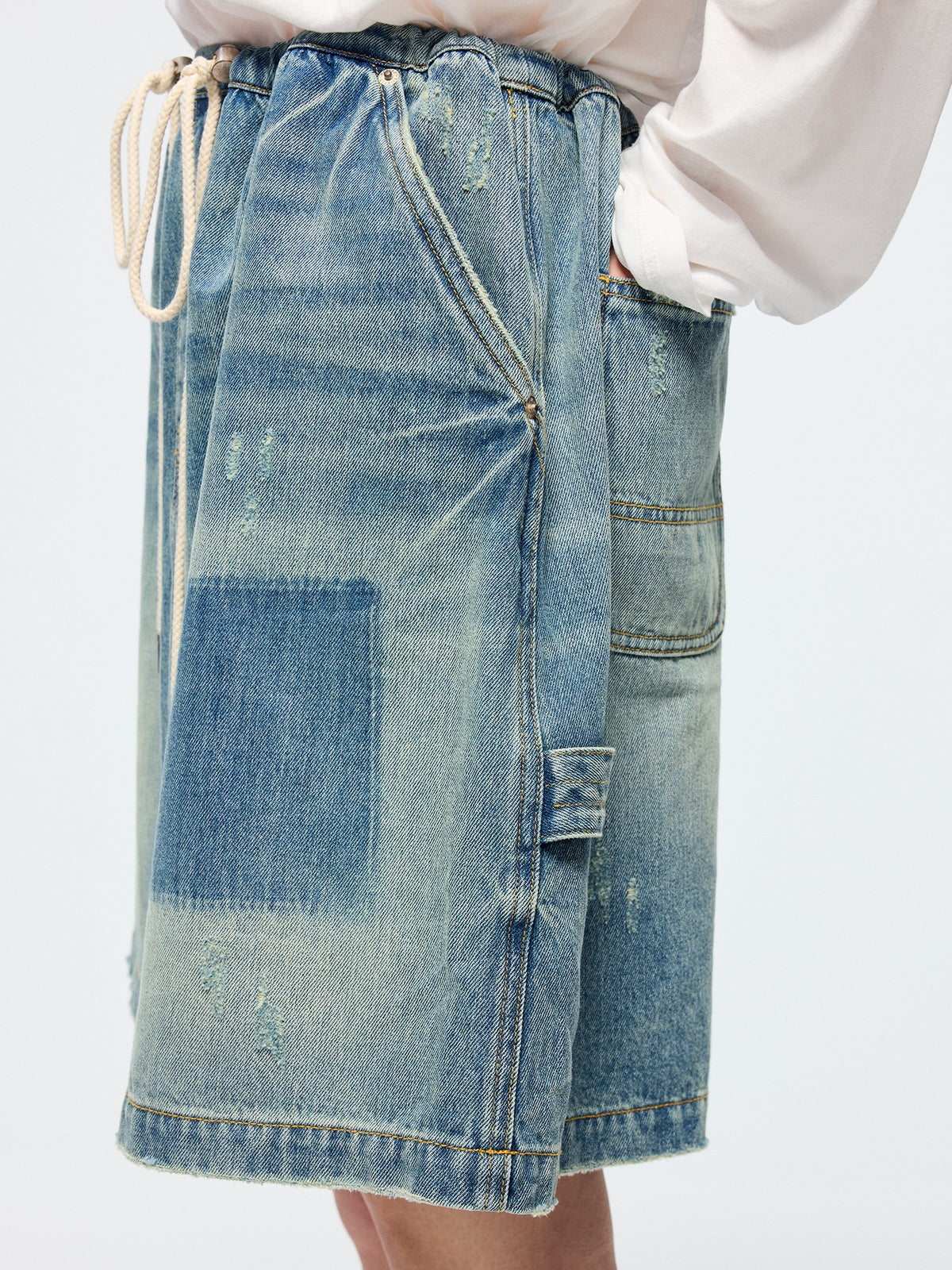 Distressed denim cargo skirt