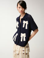 Handcrafted bow cardigan