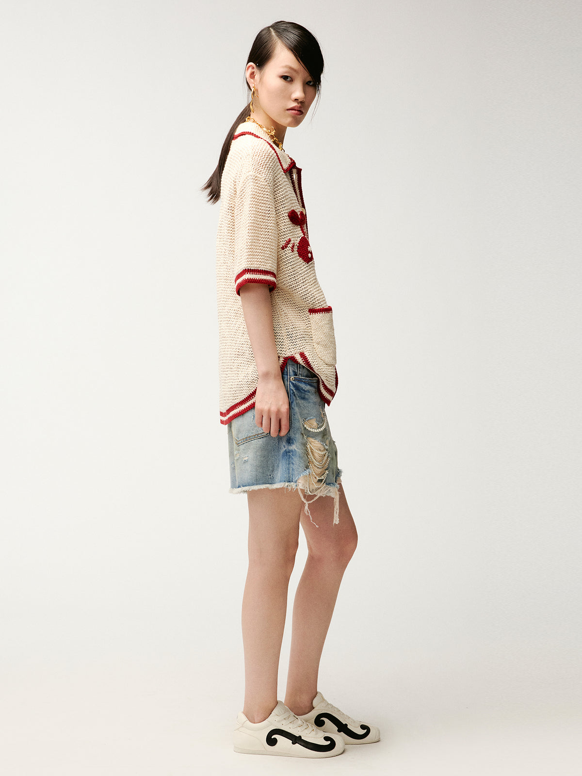 Pearl chain distressed denim shorts