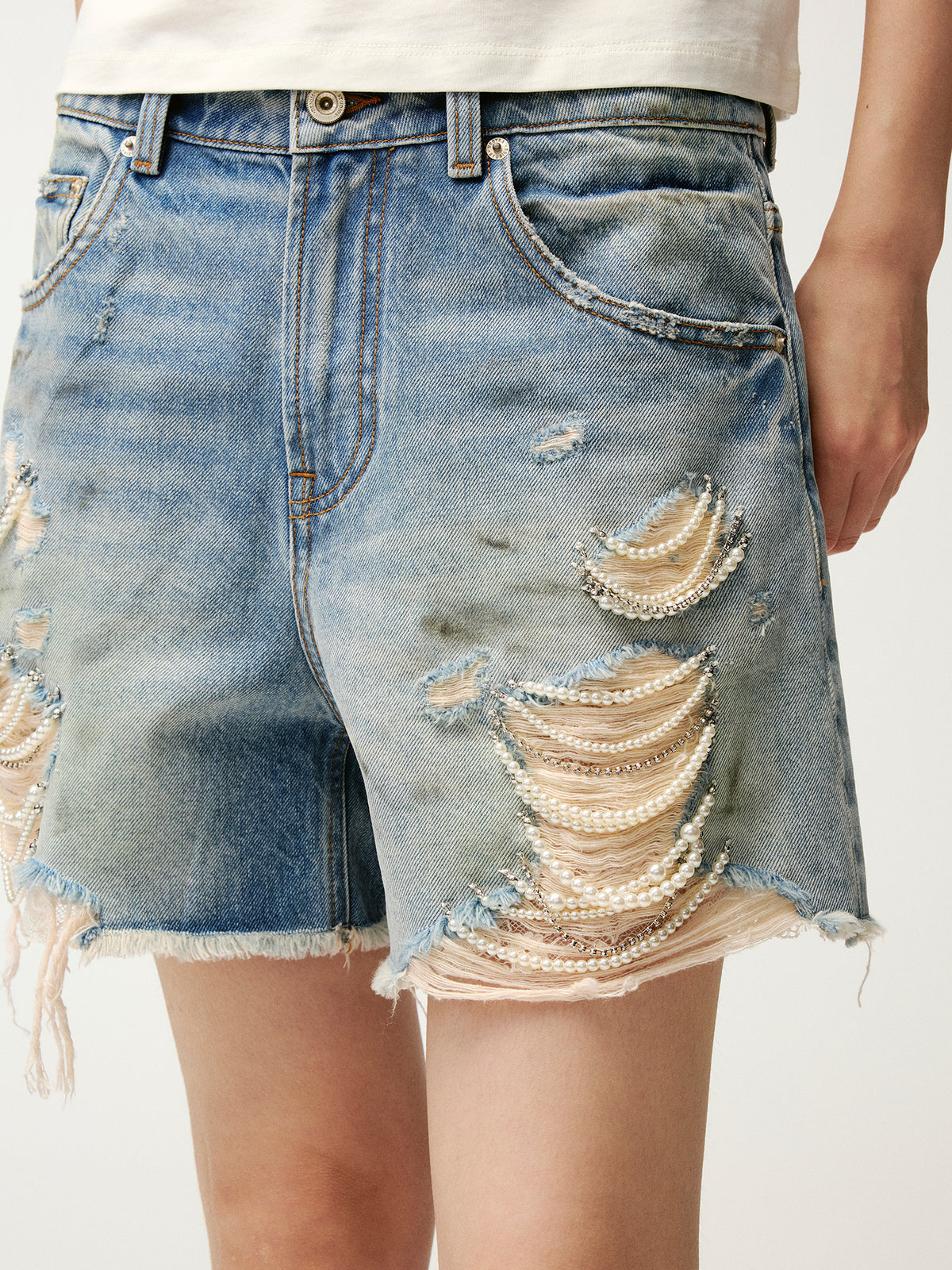 Pearl chain distressed denim shorts