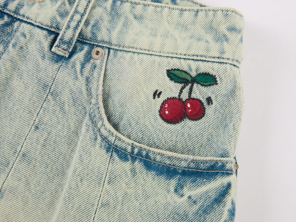 Washed pleated denim mini skirt
