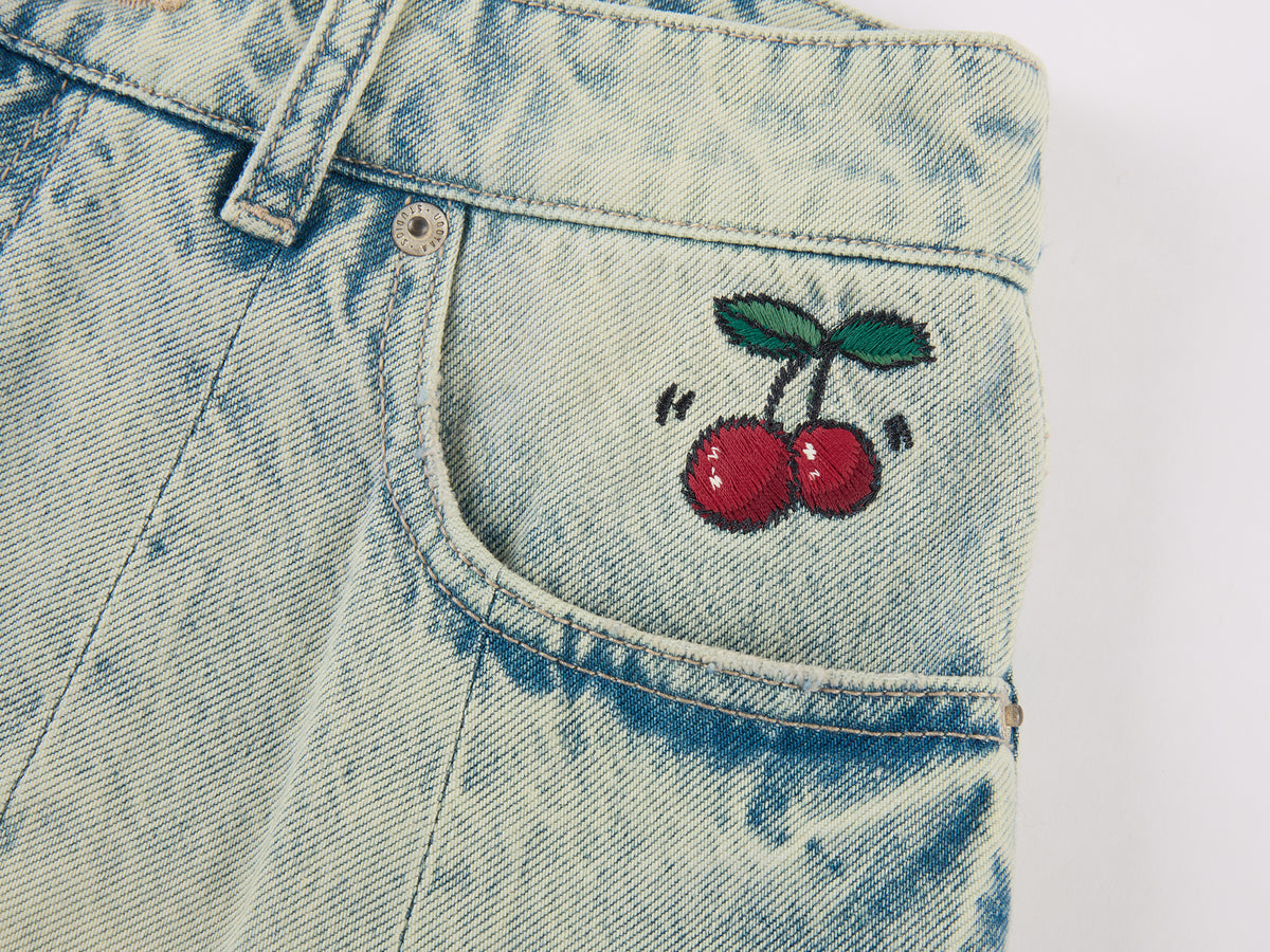 Washed pleated denim mini skirt