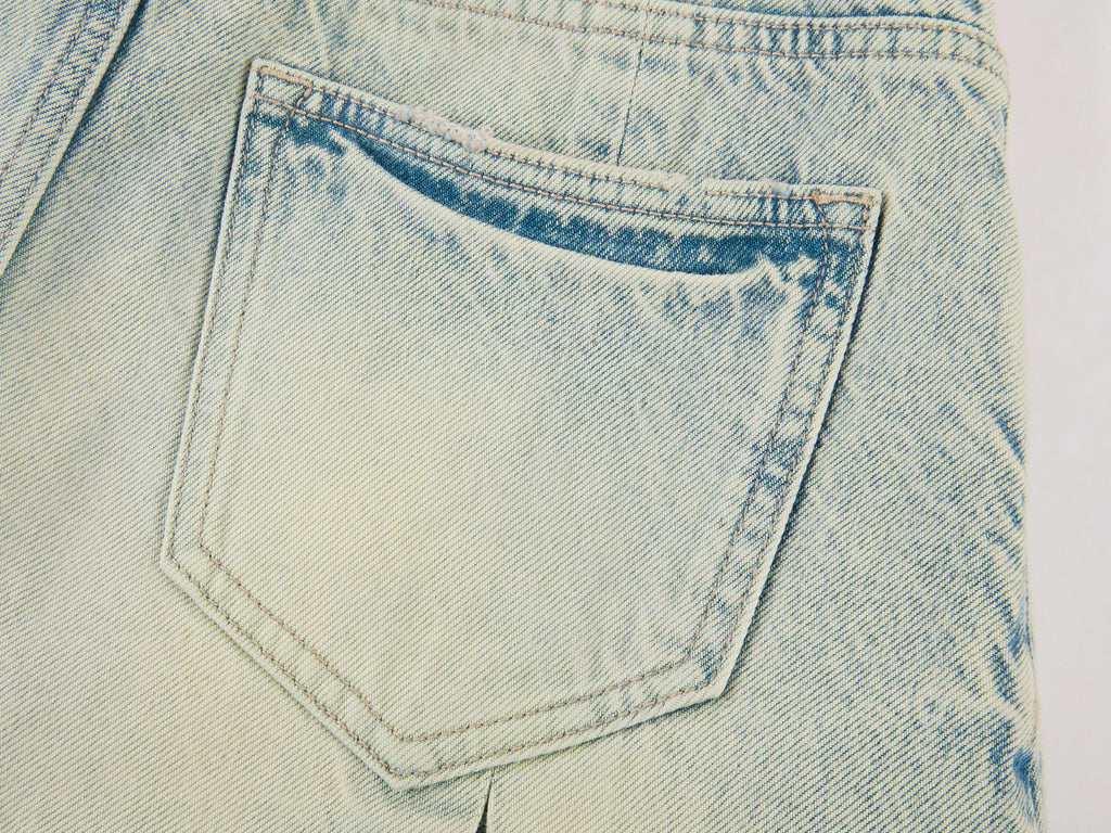 Washed pleated denim mini skirt