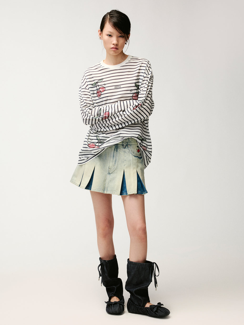 Washed pleated denim mini skirt