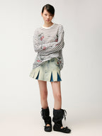 Washed pleated denim mini skirt