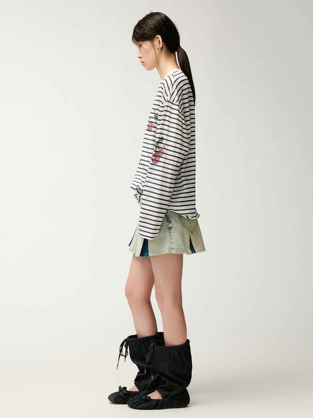 Washed pleated denim mini skirt