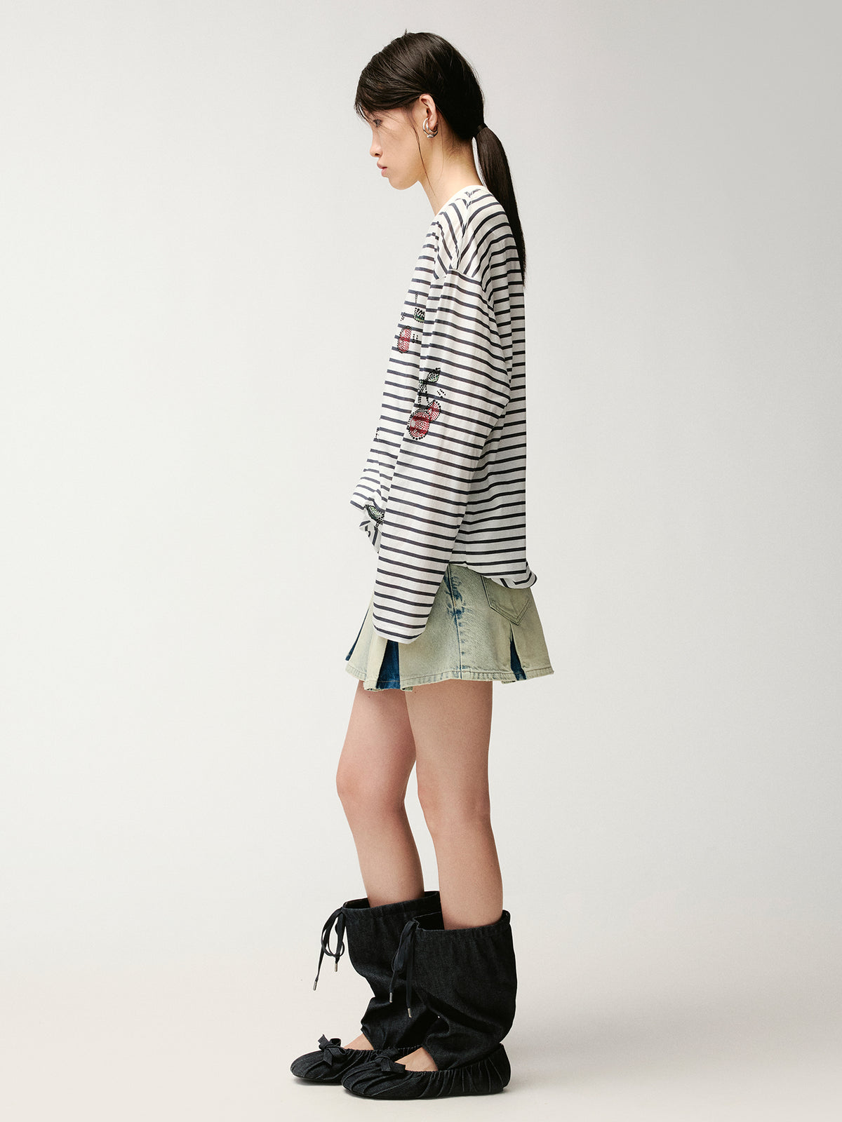 Washed pleated denim mini skirt
