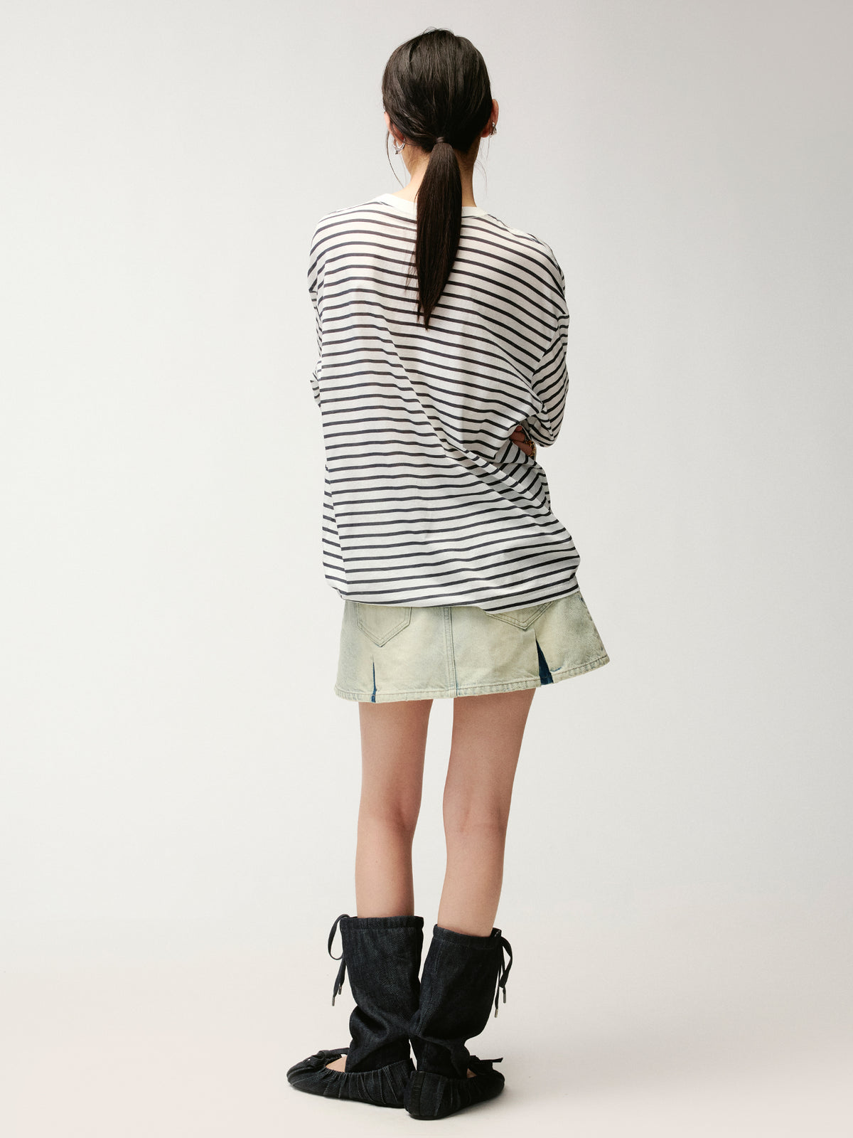 Washed pleated denim mini skirt