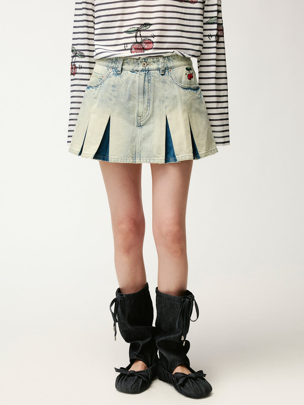 Washed pleated denim mini skirt