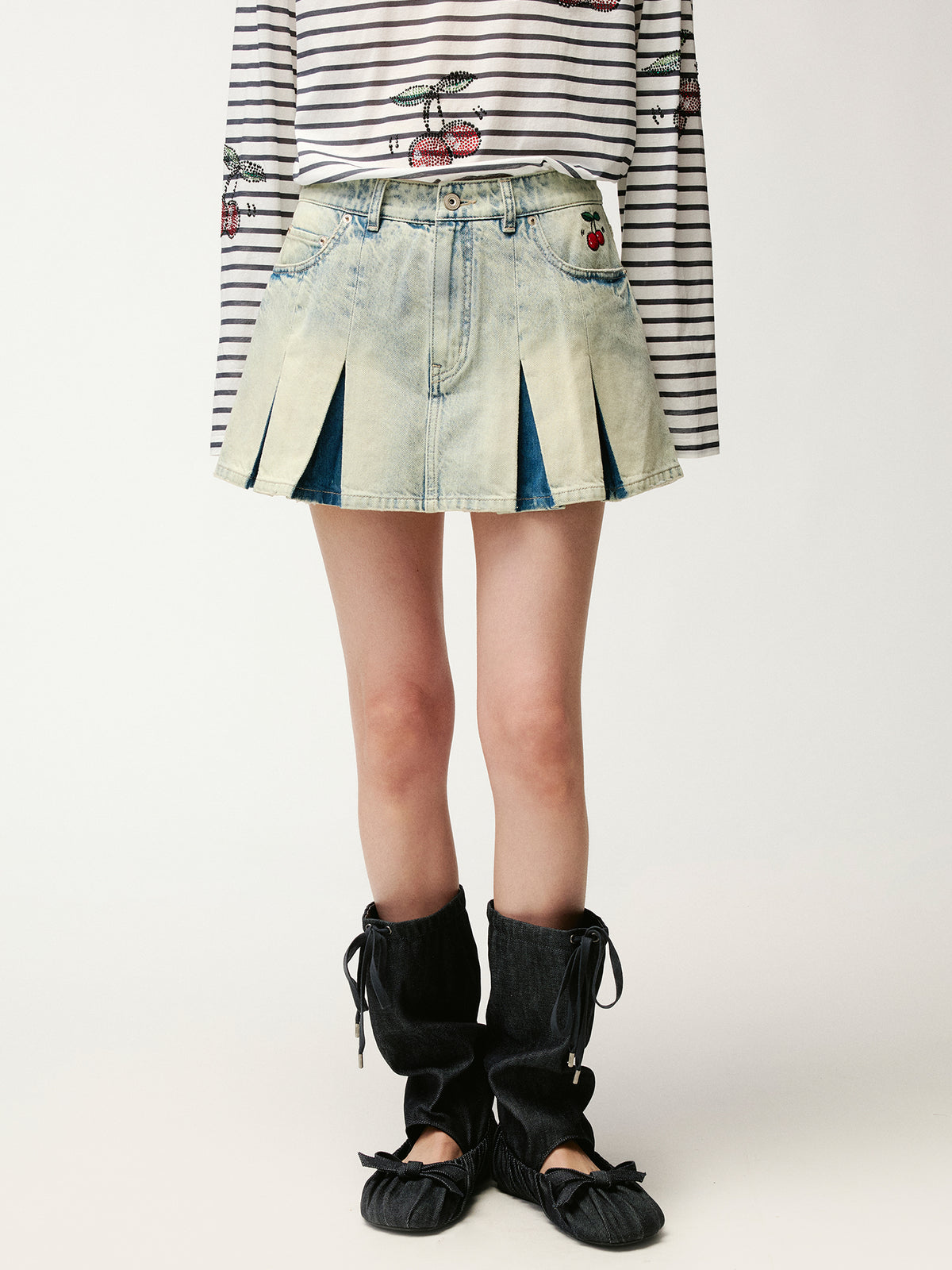 Washed pleated denim mini skirt