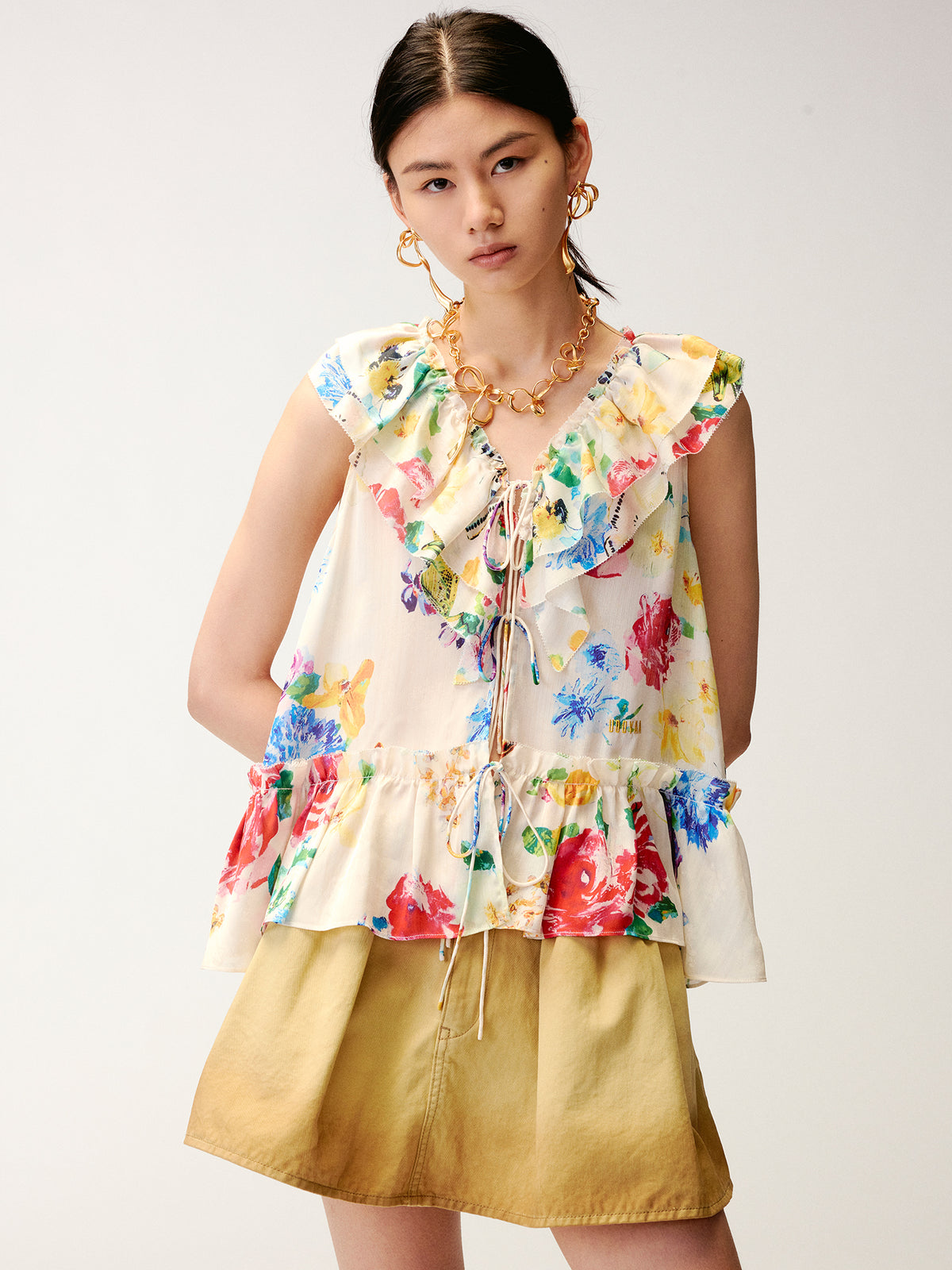 Floral ruffle and insect print vest