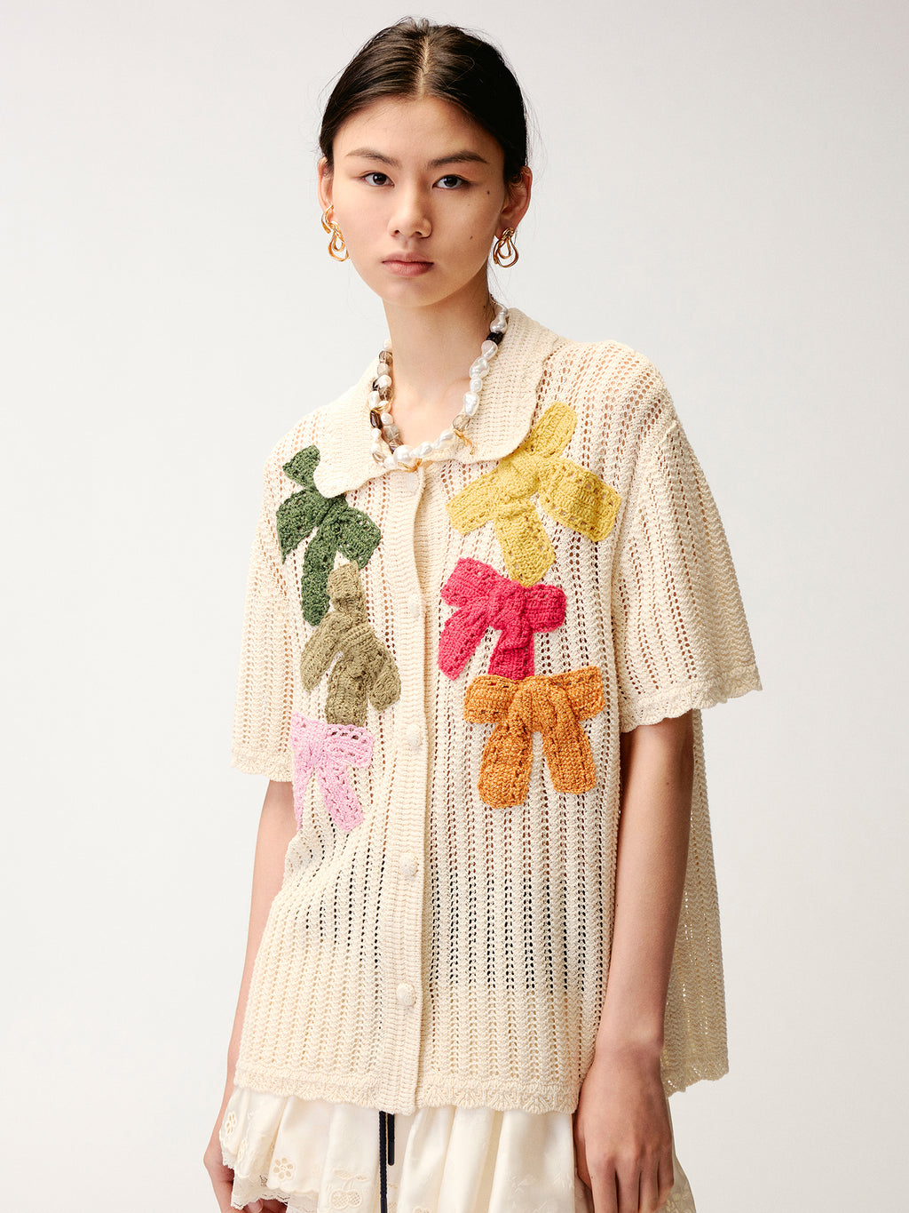Hand-crocheted bow cardigan