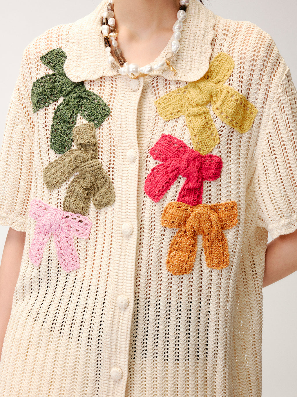 Hand-crocheted bow cardigan