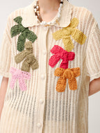 Hand-crocheted bow cardigan