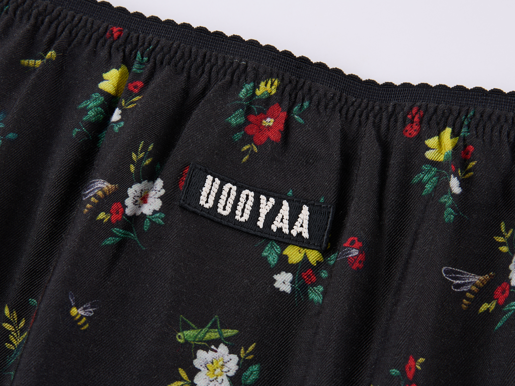 Insect motif lace trims spliced floral skirt