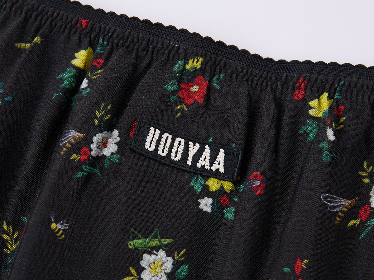 Insect motif lace trims spliced floral skirt