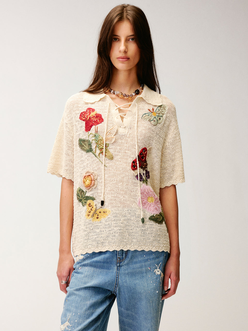 Hand-crocheted insect and floral tie-front polo knit shirt