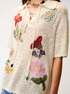 Hand-crocheted insect and floral tie-front polo knit shirt