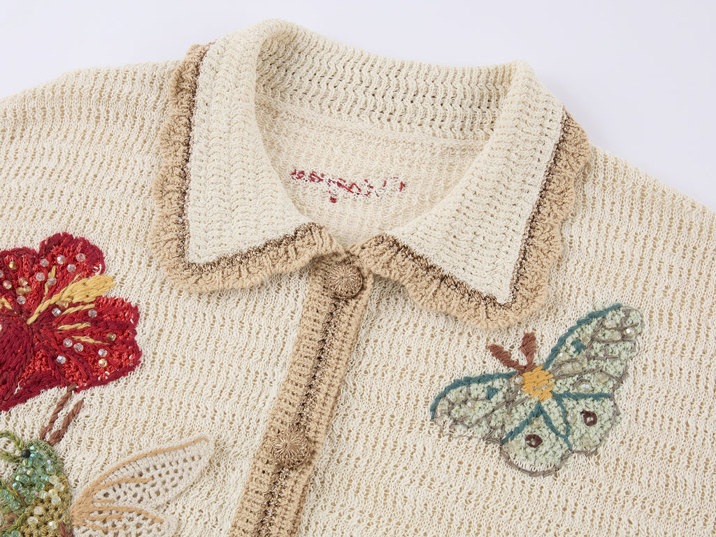 Hand-crocheted insect and floral cardigan