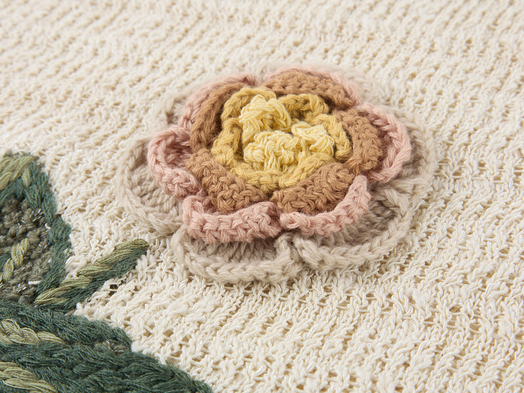 Hand-crocheted insect and floral cardigan