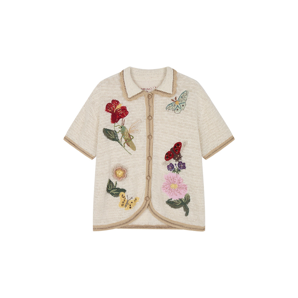 Hand-crocheted insect and floral cardigan
