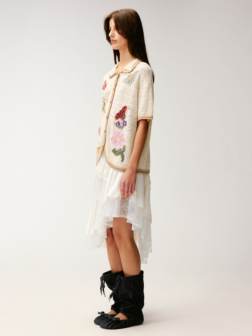 Hand-crocheted insect and floral cardigan