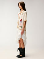 Hand-crocheted insect and floral cardigan