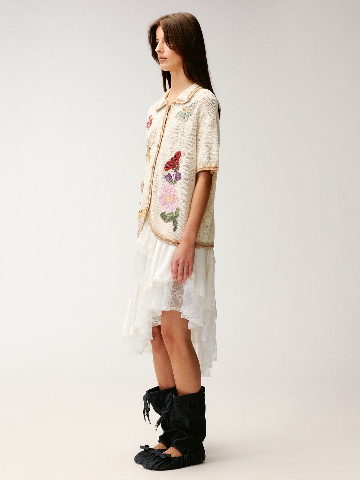 Hand-crocheted insect and floral cardigan