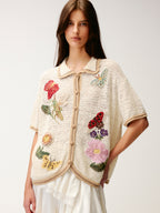 Hand-crocheted insect and floral cardigan