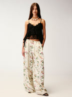 Insect and floral print curved pants