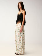 Insect and floral print curved pants