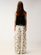 Insect and floral print curved pants