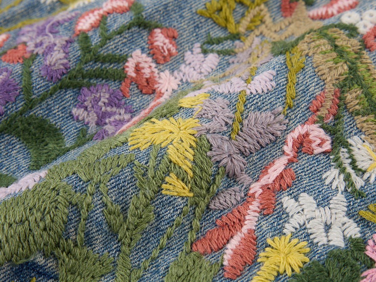 Insect and floral embroidered denim pants