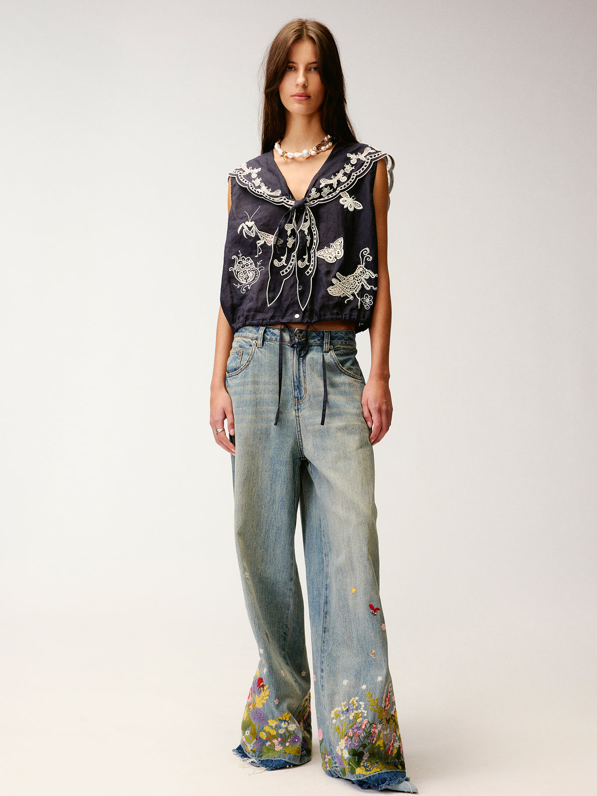 Insect and floral embroidered denim pants