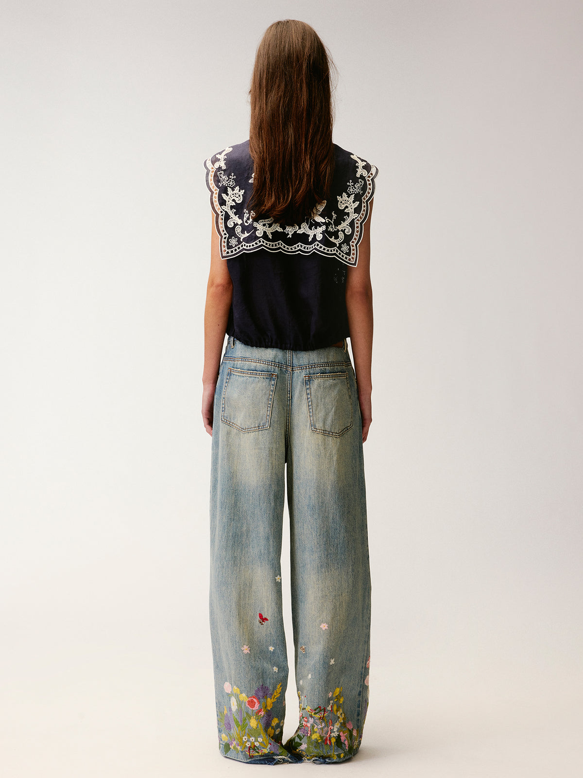Insect and floral embroidered denim pants