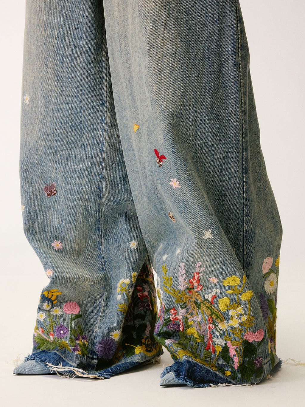 Insect and floral embroidered denim pants