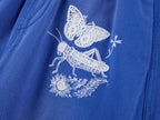 Lace insect and floral motif curved denim pants