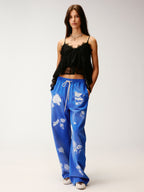 Lace insect and floral motif curved denim pants