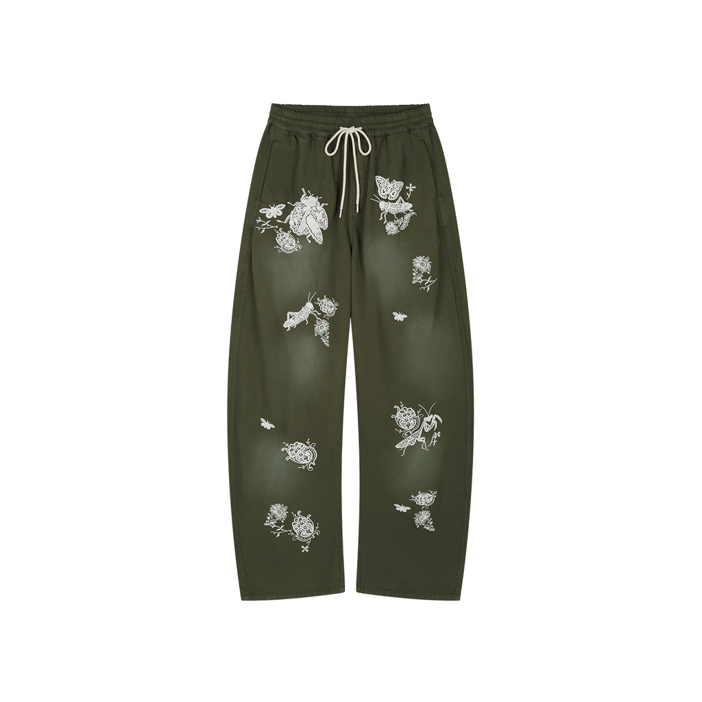 Lace insect and floral motif curved denim pants