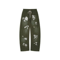 Lace insect and floral motif curved denim pants