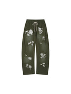 Lace insect and floral motif curved denim pants