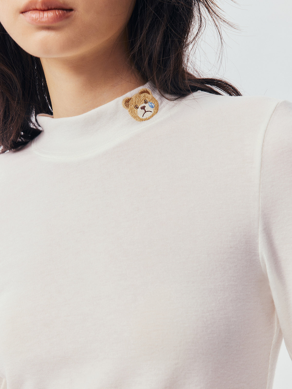 Petty Teddy Embroidered Mock Neck Top