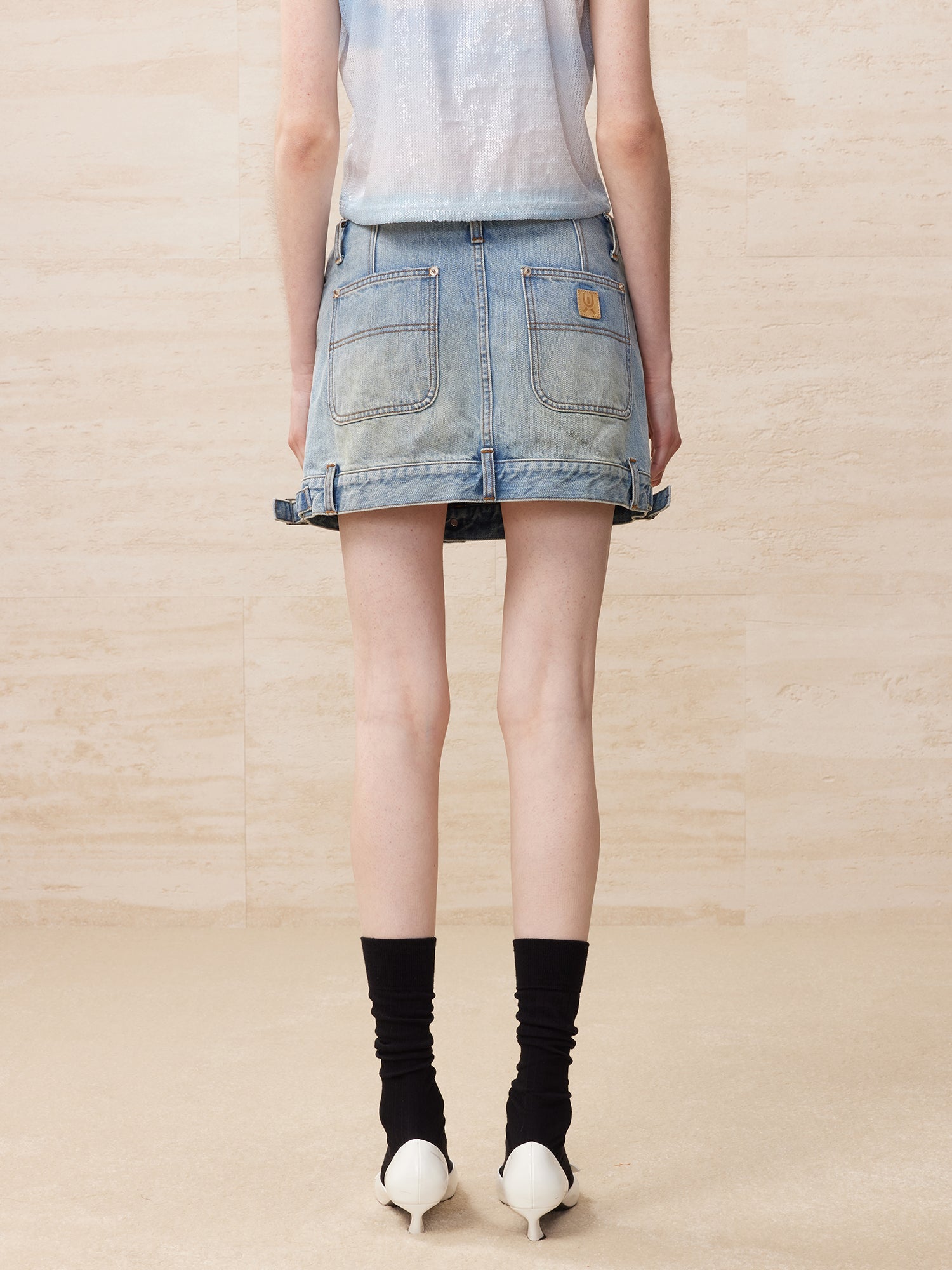 Deconstructed washed denim skirt