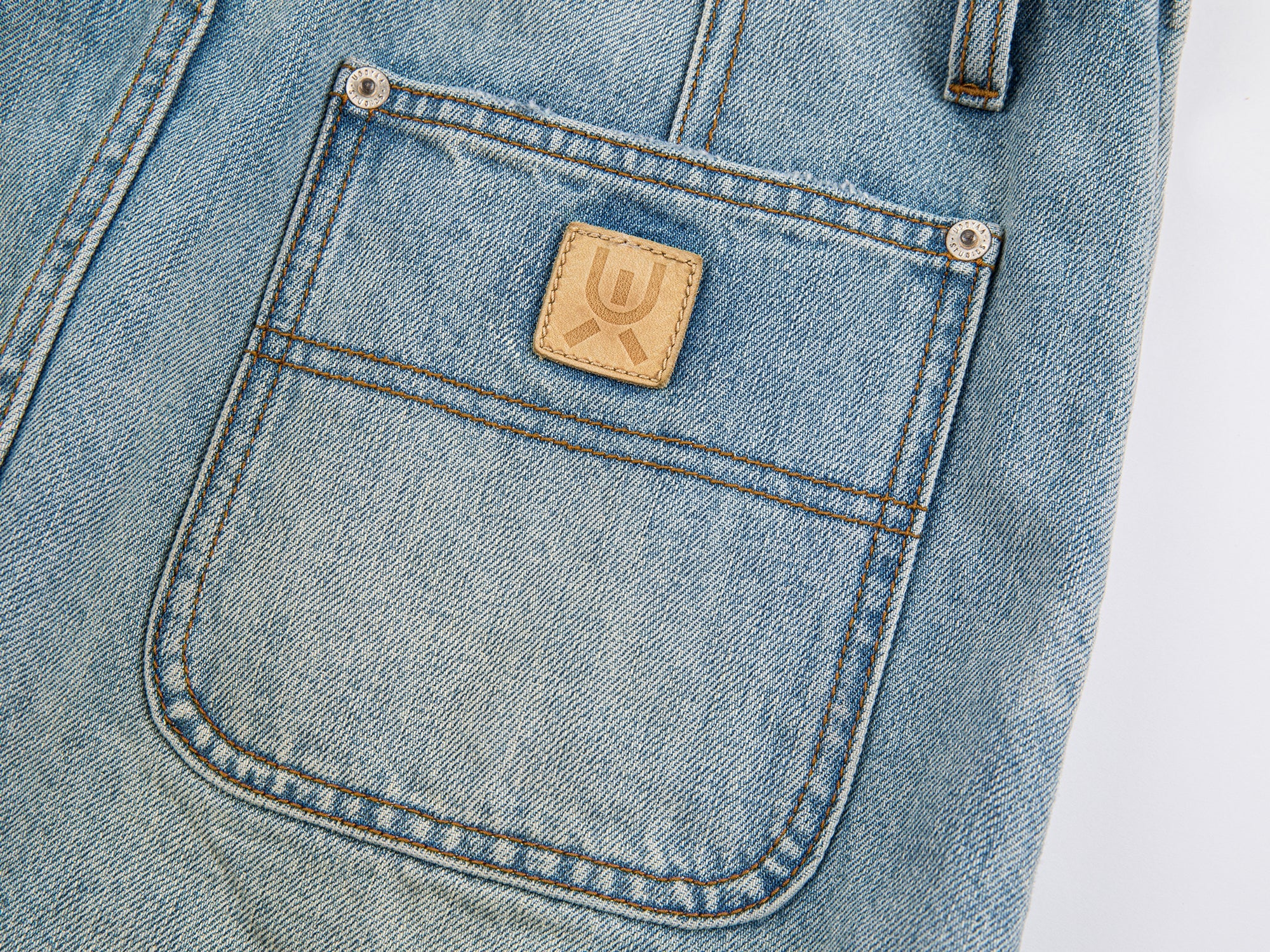 Deconstructed washed denim skirt