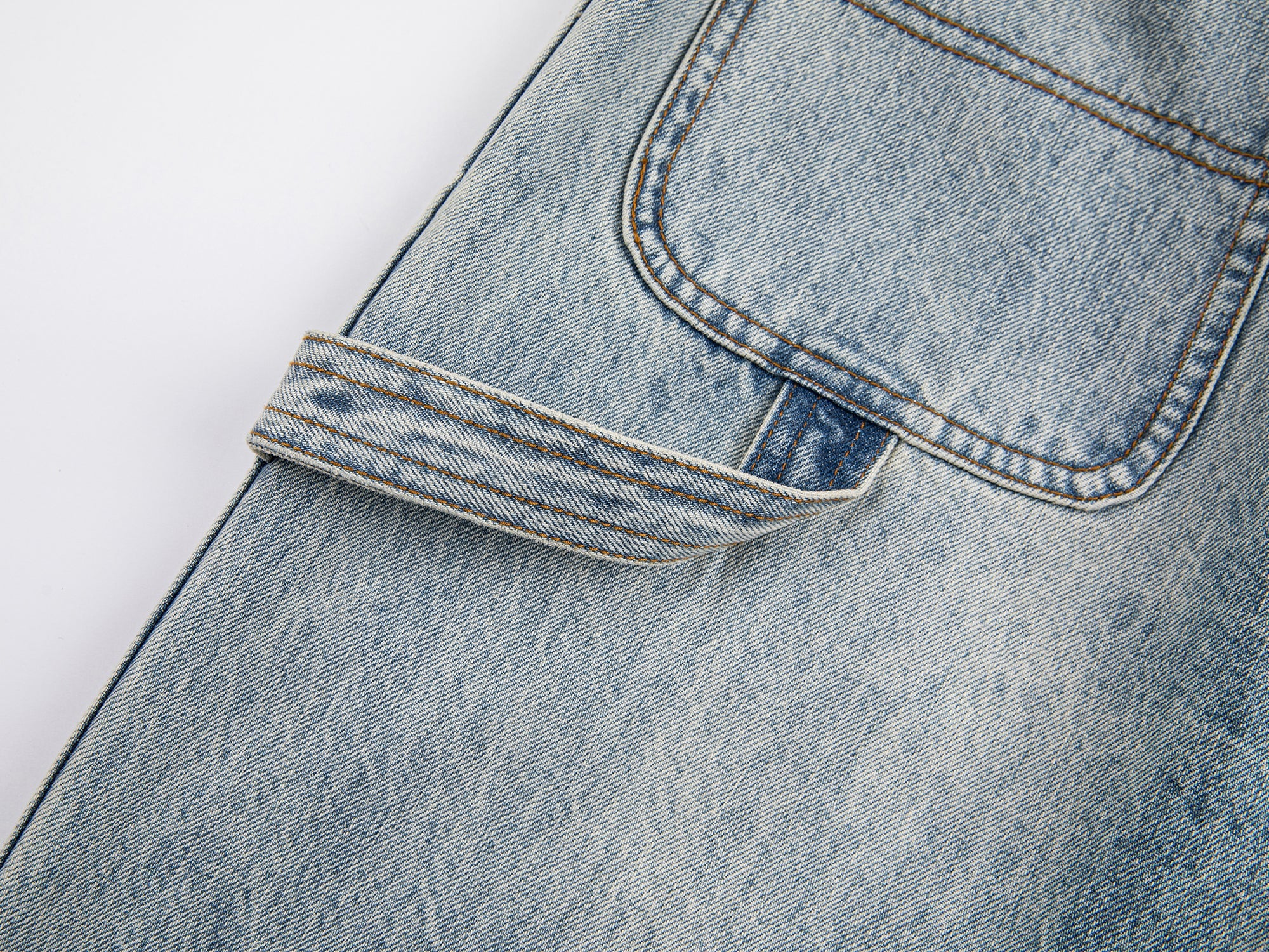 Deconstructed washed carpenter jeans